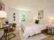 Well-lit bedroom with a desk area, stylish decor, and a comfortable atmosphere at 4754 Hedgemore Dr # E, Charlotte, NC 28209