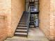 Apartment building entrance with stairs and brick facade at 4754 Hedgemore Dr # E, Charlotte, NC 28209