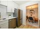 Bright kitchen with stainless steel appliances leading into the dining area at 4754 Hedgemore Dr # E, Charlotte, NC 28209