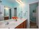 Well-lit bathroom boasts a double sink vanity with a large mirror and stylish light fixtures at 506 Academy St, Mcadenville, NC 28101
