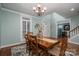 Classic dining room with a wooden table, hardwood floors, and elegant décor at 506 Academy St, Mcadenville, NC 28101