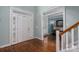 Bright foyer with hardwood floors, white trim, and a view into the living area at 506 Academy St, Mcadenville, NC 28101