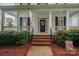 Close-up of the home's entrance featuring a wreath and classic design at 506 Academy St, Mcadenville, NC 28101