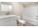 A bathroom featuring a single sink vanity with a mirror and a shower-tub combo at 5090 Beaver Dam Way, Bessemer City, NC 28016