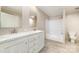 Bathroom with dual sink vanity and well-lit mirror, providing comfort and convenience at 5090 Beaver Dam Way, Bessemer City, NC 28016