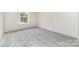 Carpeted bedroom with a window and neutral-colored walls at 5090 Beaver Dam Way, Bessemer City, NC 28016