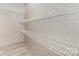 Walk-in closet with white wire shelving providing organized storage space at 5090 Beaver Dam Way, Bessemer City, NC 28016