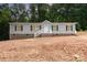 Charming single-Gathering home featuring gray siding, black shutters, and a welcoming front porch with white railings at 5090 Beaver Dam Way, Bessemer City, NC 28016