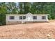 Charming single-Gathering home featuring gray siding, black shutters, and a welcoming front porch with white railings at 5090 Beaver Dam Way, Bessemer City, NC 28016
