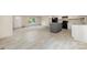 A spacious kitchen with stainless steel appliances and an island offers a seamless transition to the living area at 5090 Beaver Dam Way, Bessemer City, NC 28016