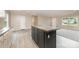 Open-concept living space with island and lots of natural light, perfect for modern living and entertaining at 5090 Beaver Dam Way, Bessemer City, NC 28016