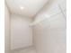Simple walk-in closet featuring shelving, offering functional storage for clothing and accessories at 5090 Beaver Dam Way, Bessemer City, NC 28016