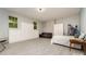 Finished basement features gray flooring, white walls, a bed, seating and closets at 524 Heritage Vw, Indian Trail, NC 28079