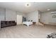 Finished basement features gray flooring, white walls, a bed, seating, closet and access at 524 Heritage Vw, Indian Trail, NC 28079