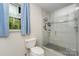 Bathroom with a sleek, glass shower, and a window adding natural light at 524 Heritage Vw, Indian Trail, NC 28079