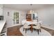 Bright dining area with wood floors, a chandelier, and seating for four at 524 Heritage Vw, Indian Trail, NC 28079