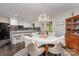 Bright dining area connected to kitchen featuring wood floors and chandelier at 524 Heritage Vw, Indian Trail, NC 28079