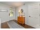 Cozy entryway with decorative rug, wooden dresser, and charming wall decor at 524 Heritage Vw, Indian Trail, NC 28079