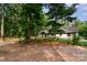 Beautiful wooded lot with charming home and a fire pit area perfect for enjoying the natural surroundings at 524 Heritage Vw, Indian Trail, NC 28079