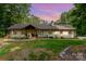Charming single-story home with a brick facade, beautiful landscaping, and a cozy front entrance at 524 Heritage Vw, Indian Trail, NC 28079
