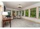Tile floor sunroom with many windows letting in natural light at 524 Heritage Vw, Indian Trail, NC 28079