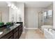 Modern bathroom with double vanity, granite countertop, soaking tub and glass enclosed shower at 537 Lakeview Dr, Mcadenville, NC 28101