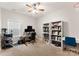 Bright bedroom with ceiling fan, natural light, a desk and chair, and shelving unit at 537 Lakeview Dr, Mcadenville, NC 28101