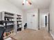 Neutral-toned bedroom with built-in shelving, a closet with basketball hoop, and carpeted flooring at 537 Lakeview Dr, Mcadenville, NC 28101