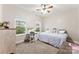 Comfortable bedroom with natural light, a ceiling fan, and desk with mirror at 537 Lakeview Dr, Mcadenville, NC 28101