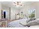 Cozy bedroom with white dresser, light colored walls, and natural sunlight from the windows at 537 Lakeview Dr, Mcadenville, NC 28101