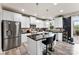 Bright open kitchen features stainless steel appliances, large island and white cabinetry at 537 Lakeview Dr, Mcadenville, NC 28101