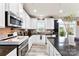 View of the bright kitchen featuring stainless appliances, granite countertops and stylish backsplash at 537 Lakeview Dr, Mcadenville, NC 28101