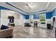 Living room with hardwood floors, wainscotting and blue accent walls at 537 Lakeview Dr, Mcadenville, NC 28101