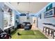 Recreation room with golf simulator, blue walls, and a comfortable leather couch at 537 Lakeview Dr, Mcadenville, NC 28101