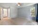 Neutral bedroom features carpet flooring, a window, and an ensuite bathroom at 6516 Laurel Springs Ct, Charlotte, NC 28227