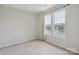 This bedroom features neutral walls, carpet and two windows with a view of the lake at 6516 Laurel Springs Ct, Charlotte, NC 28227