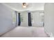 This bedroom features neutral walls, carpet and three windows providing natural light at 6516 Laurel Springs Ct, Charlotte, NC 28227