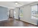 Bright, spacious living room with hardwood floors and large windows at 6516 Laurel Springs Ct, Charlotte, NC 28227