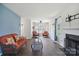 Cozy living room with hardwood floors, fireplace, and comfortable seating at 6516 Laurel Springs Ct, Charlotte, NC 28227