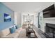 Bright, staged living room featuring hardwood floors, fireplace, and adjacent dining area with natural light at 6516 Laurel Springs Ct, Charlotte, NC 28227