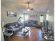 Inviting living room featuring hardwood floors, ceiling fan, and neutral color scheme, creating a cozy atmosphere at 6902 Vernon Wood Ln, Charlotte, NC 28262