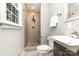 Modern bathroom featuring a walk-in shower with tiled walls and a sleek vanity with updated fixtures at 6935 Woodstock Dr, Charlotte, NC 28210