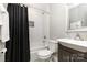Bathroom features a white subway tile shower, black shower curtain, and neutral paint at 6935 Woodstock Dr, Charlotte, NC 28210