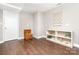 Versatile bonus room with hardwood floors, storage shelving and basket, and a neutral color scheme at 6935 Woodstock Dr, Charlotte, NC 28210