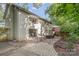 Large backyard with brick patio area featuring outdoor seating, and a well-maintained brick house exterior at 6935 Woodstock Dr, Charlotte, NC 28210