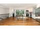 Eat-in kitchen features stainless appliances, granite countertops, and a large window for natural light at 6935 Woodstock Dr, Charlotte, NC 28210