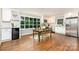 Eat-in kitchen features stainless appliances, granite countertops, and a large window for natural light at 6935 Woodstock Dr, Charlotte, NC 28210