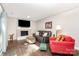 Cozy living room featuring a fireplace, comfortable seating, and plenty of natural light from sliding glass door at 6935 Woodstock Dr, Charlotte, NC 28210