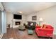 Inviting living room features a cozy fireplace and comfortable seating, perfect for relaxing and entertaining guests at 6935 Woodstock Dr, Charlotte, NC 28210
