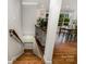 Staircase leading to open kitchen and dining area at 6935 Woodstock Dr, Charlotte, NC 28210